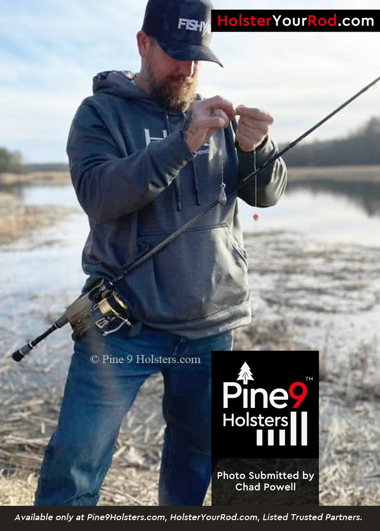 Angler using Pine 9 fishing rod holster while surf fishing on shoreline