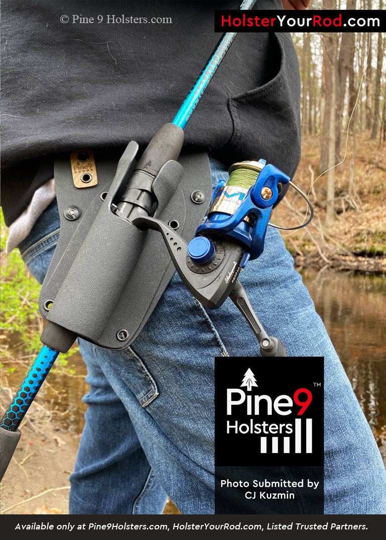 Close-up of Pine 9 fishing rod holster worn on belt during shoreline fishing