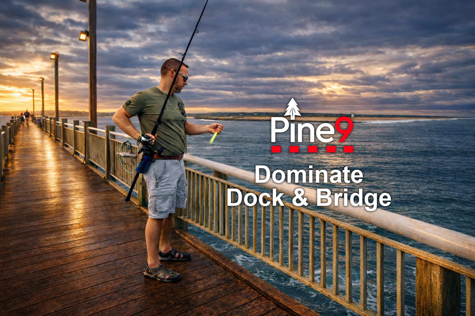 pine 9 JettyHawk fishing rod holster hands free hip rod hip holder man standing on a bridge or dock ocean fishing with rod holstered safely