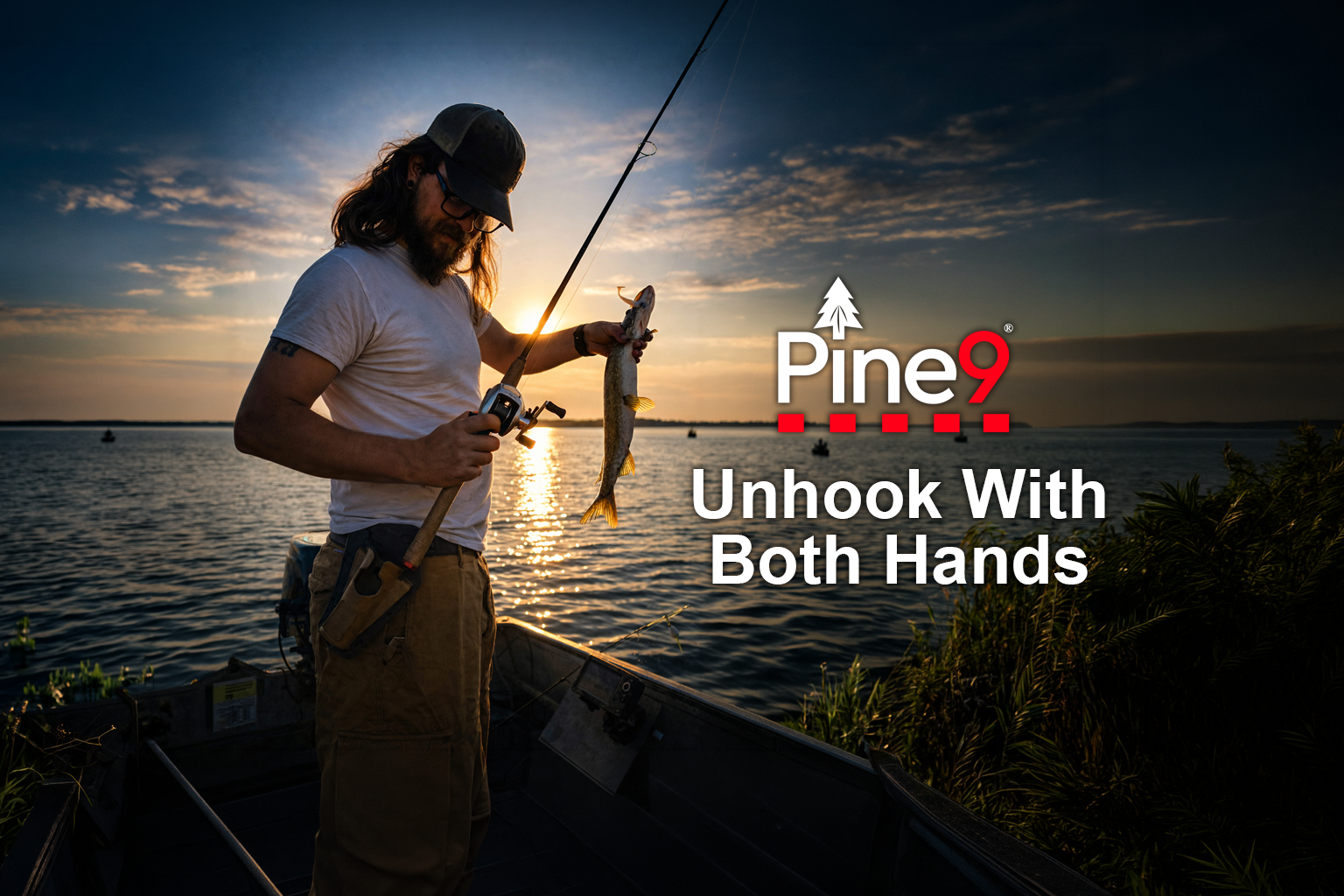 pine 9 JettyHawk fishing rod holster hands free hip rod hip holder man holding a pike pickerel standing a boat holstering his rod ready to unhook the fish 