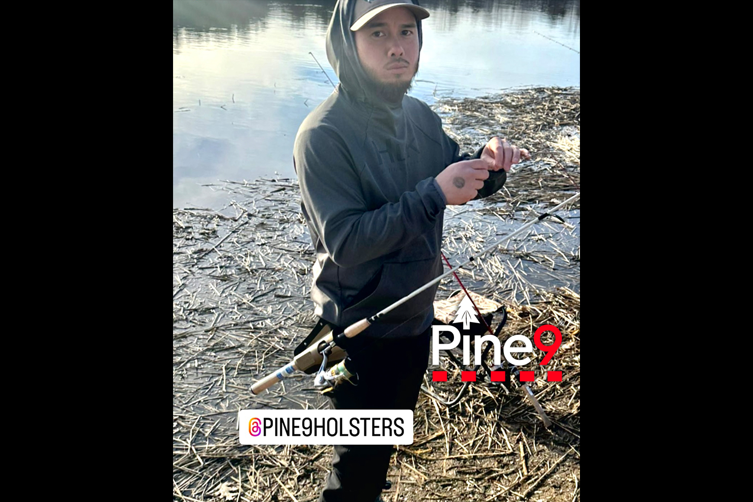 pine 9 JettyHawk fishing rod holster hands free hip rod hip holder man standing in mud with his rod fully protected in rod mounted hip holder