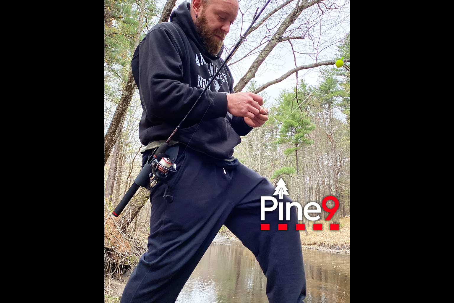 pine 9 JettyHawk fishing rod holster hands free hip rod hip holder man tying fishing line knots with rod in holder