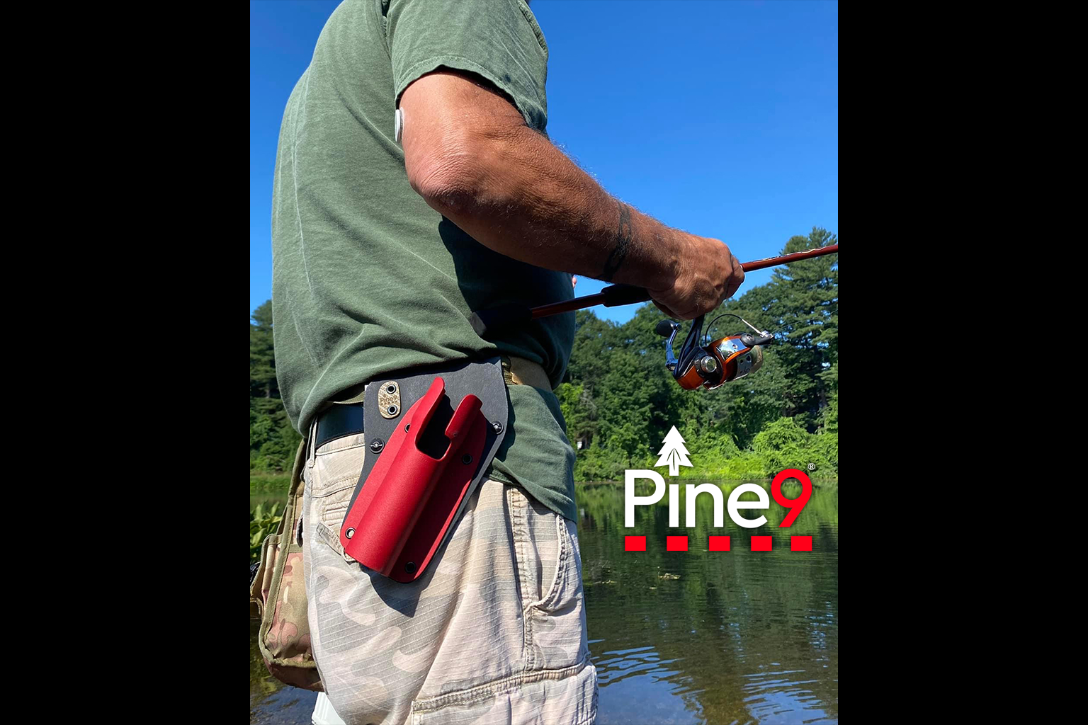 pine 9 JettyHawk fishing rod holster hands free hip rod hip holder man with red fishing rod holster standing next to river fishing