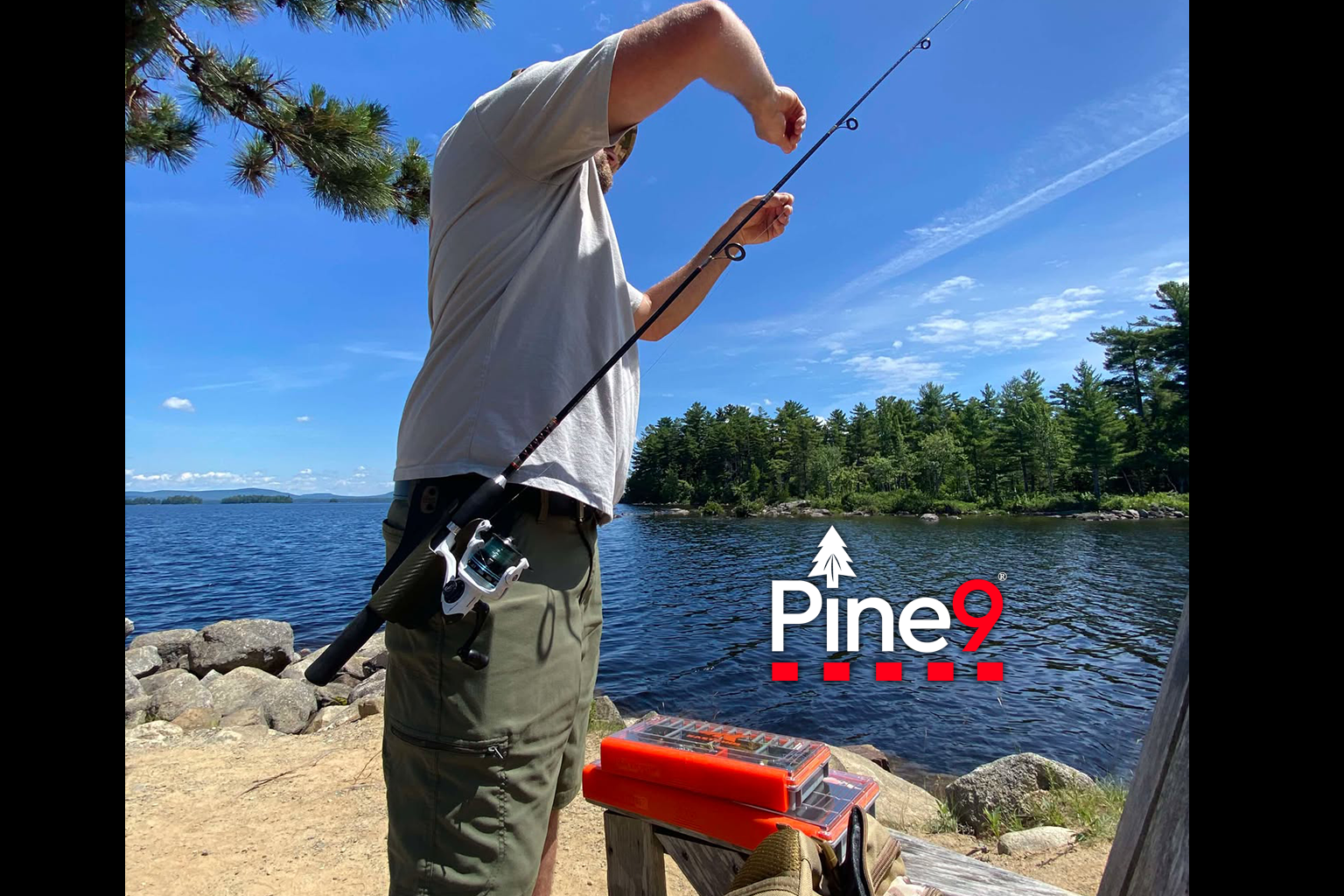 pine 9 JettyHawk fishing rod holster hands free hip rod hip holder man fixing his fishing gear with both free hands