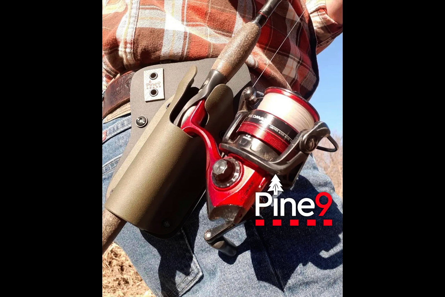 pine 9 JettyHawk fishing rod holster hands free hip rod hip holder man with a plaid shirt and red fishing rod secured in this hip mounted rod holster