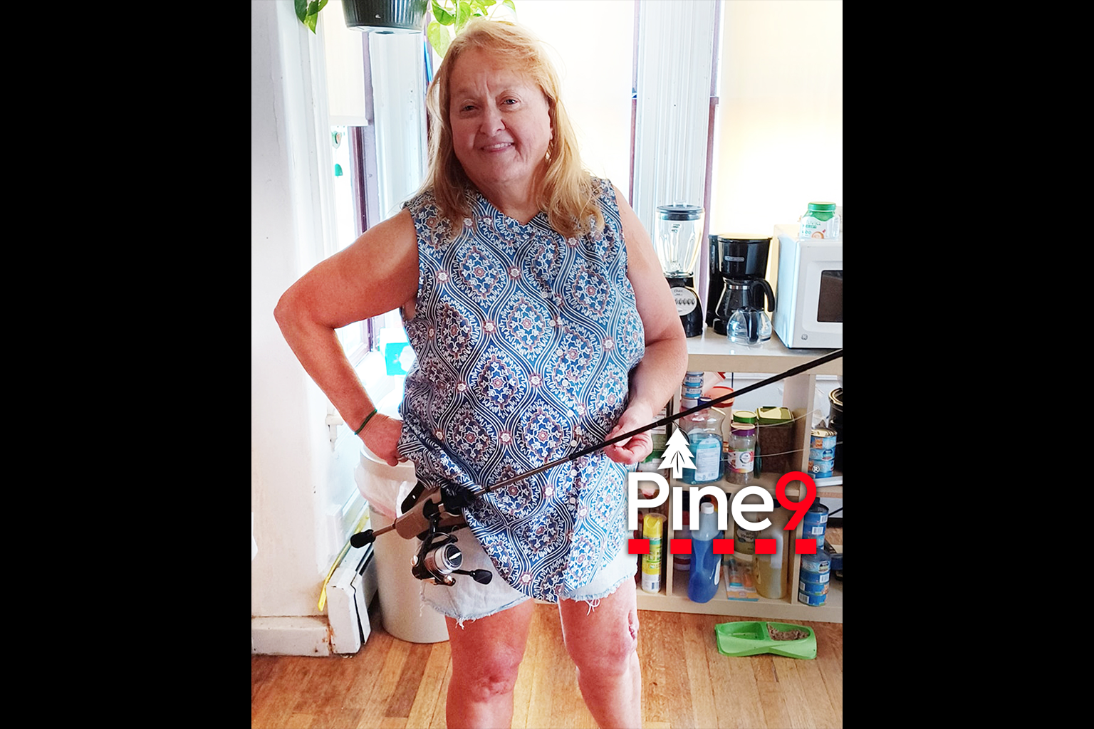 pine 9 JettyHawk fishing rod holster hands free hip rod hip holder woman trying out her new Ambie fishing rod holster in her home